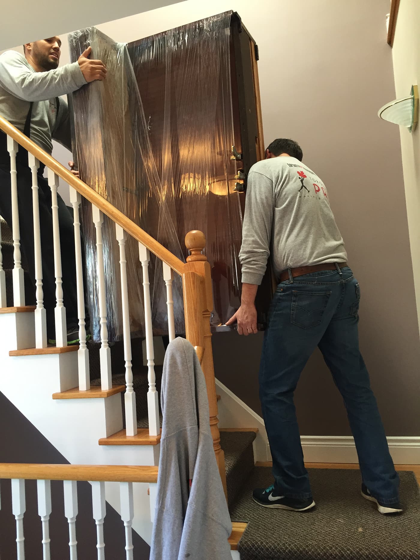 Professional movers handling commercial office relocation equipment